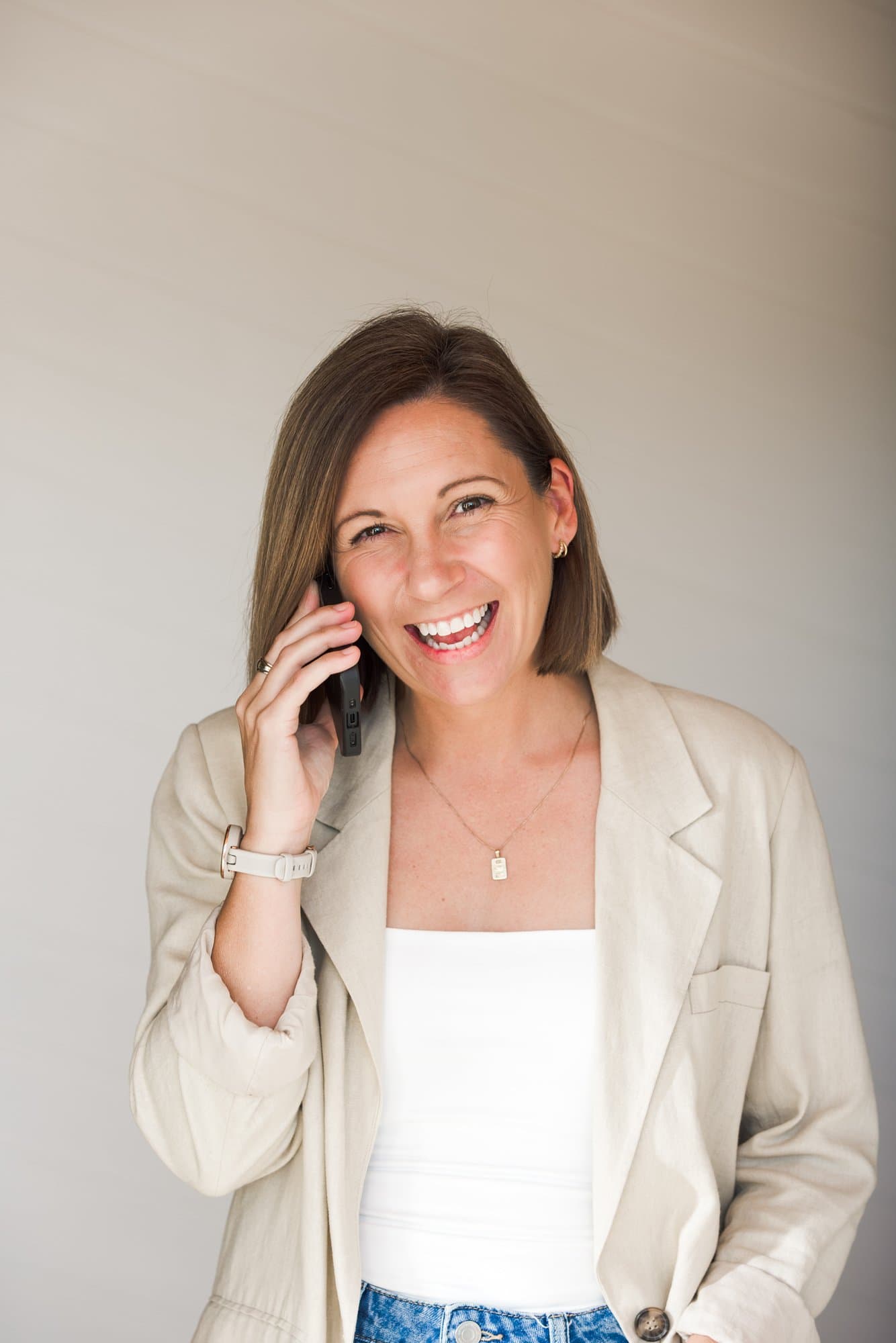 Steph laughing on a phone call